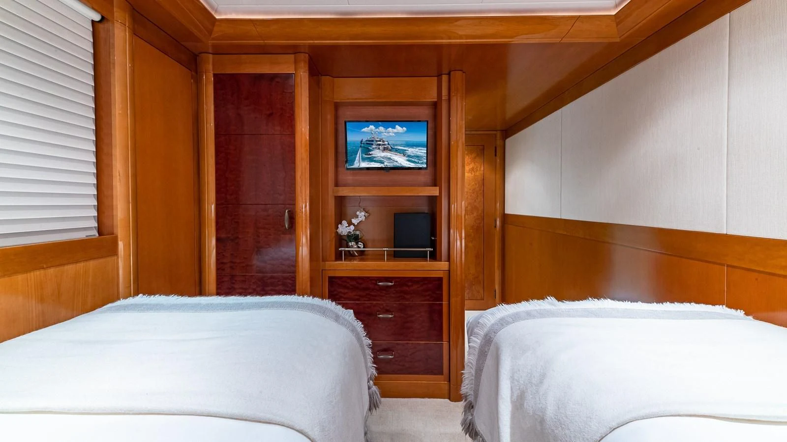 a room with a television and a bed aboard AS YOU WISH Yacht for Sale