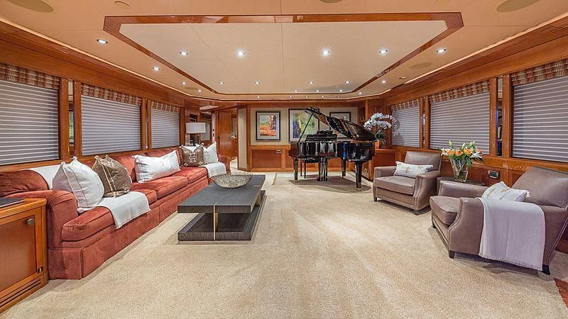 a living room with a piano and a piano aboard AS YOU WISH Yacht for Sale