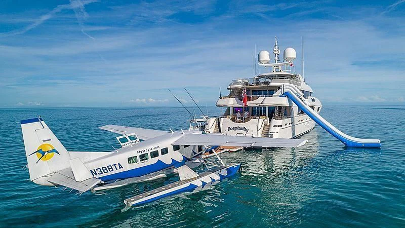 a couple of large boats in the water aboard AS YOU WISH Yacht for Sale
