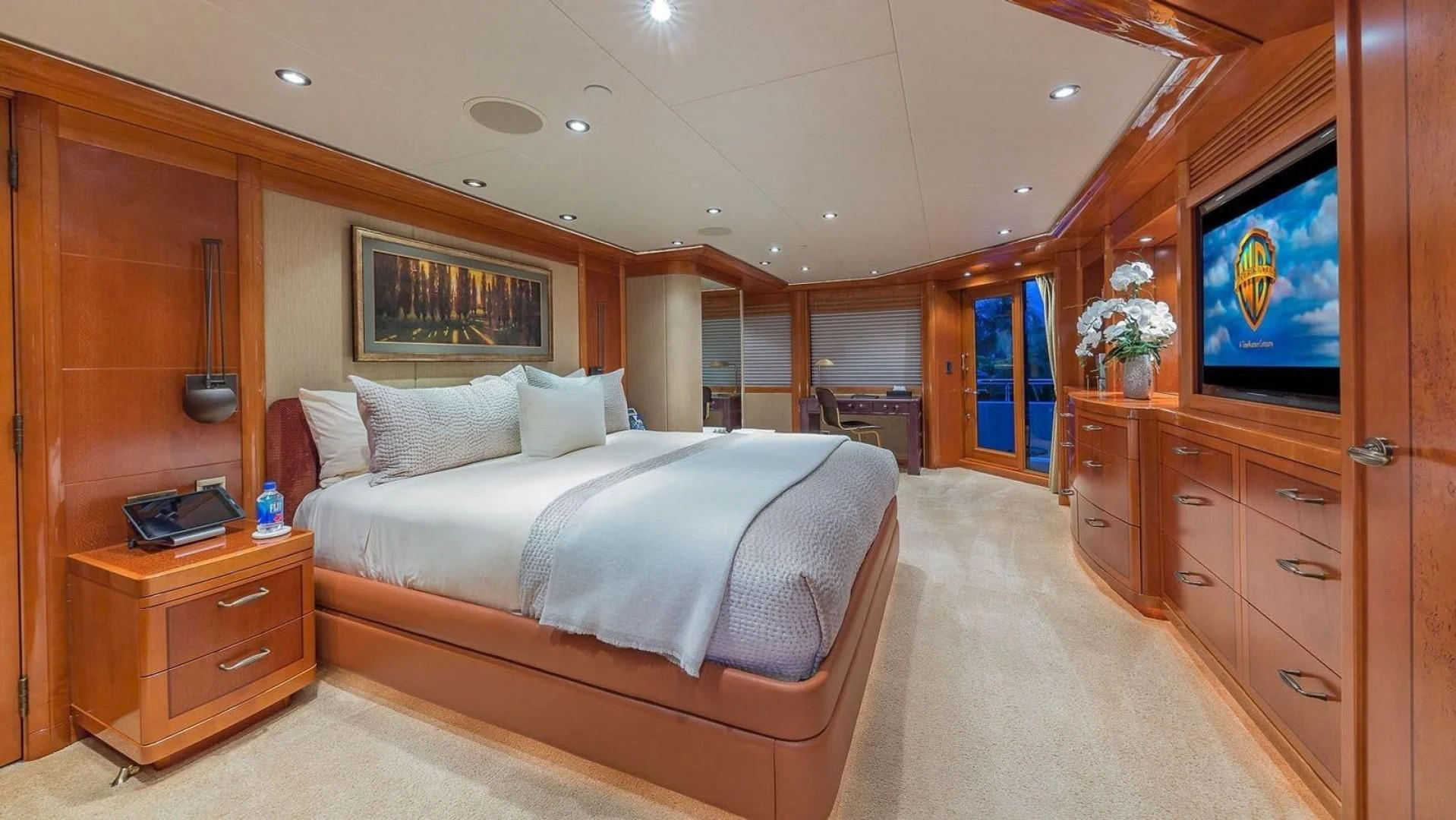 a bedroom with a bed and a tv aboard AS YOU WISH Yacht for Sale