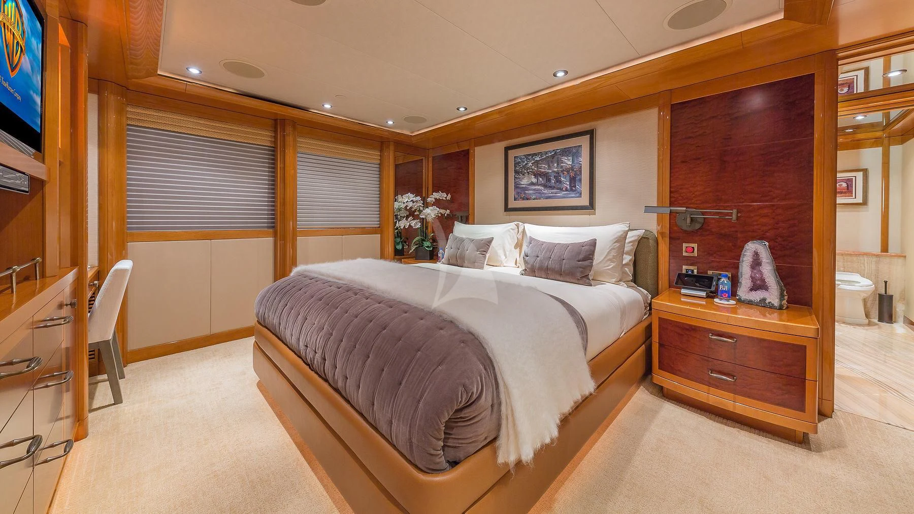 a bedroom with a bed and a television aboard AS YOU WISH Yacht for Sale