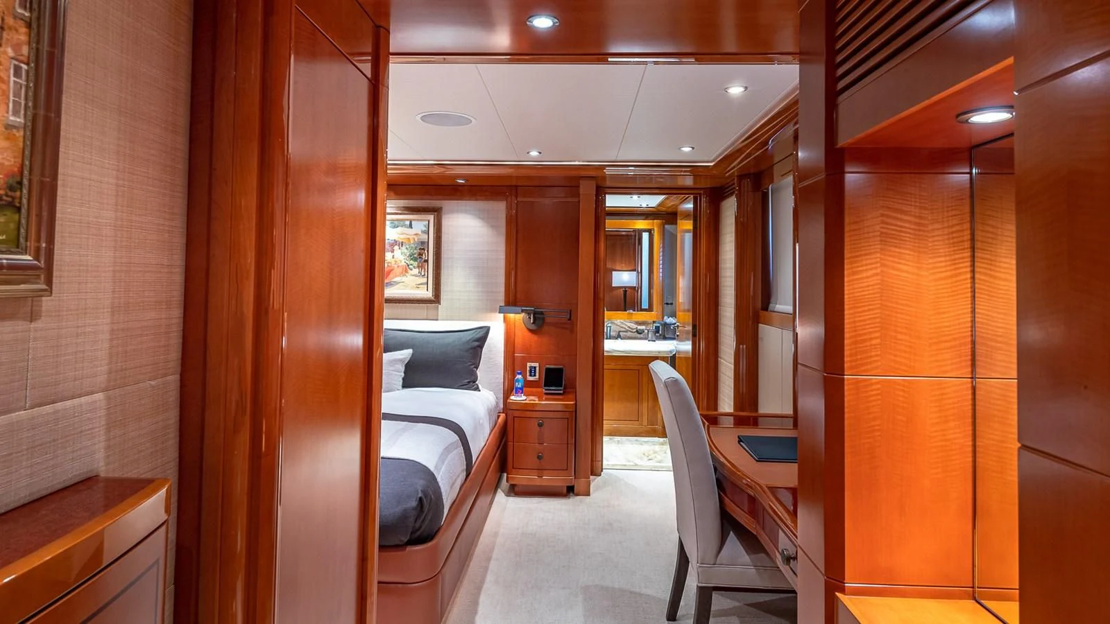 a room with a bed and desk aboard AS YOU WISH Yacht for Sale