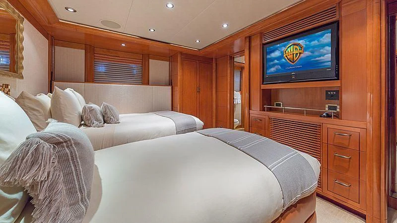 a room with a bed and a tv on the wall aboard AS YOU WISH Yacht for Sale