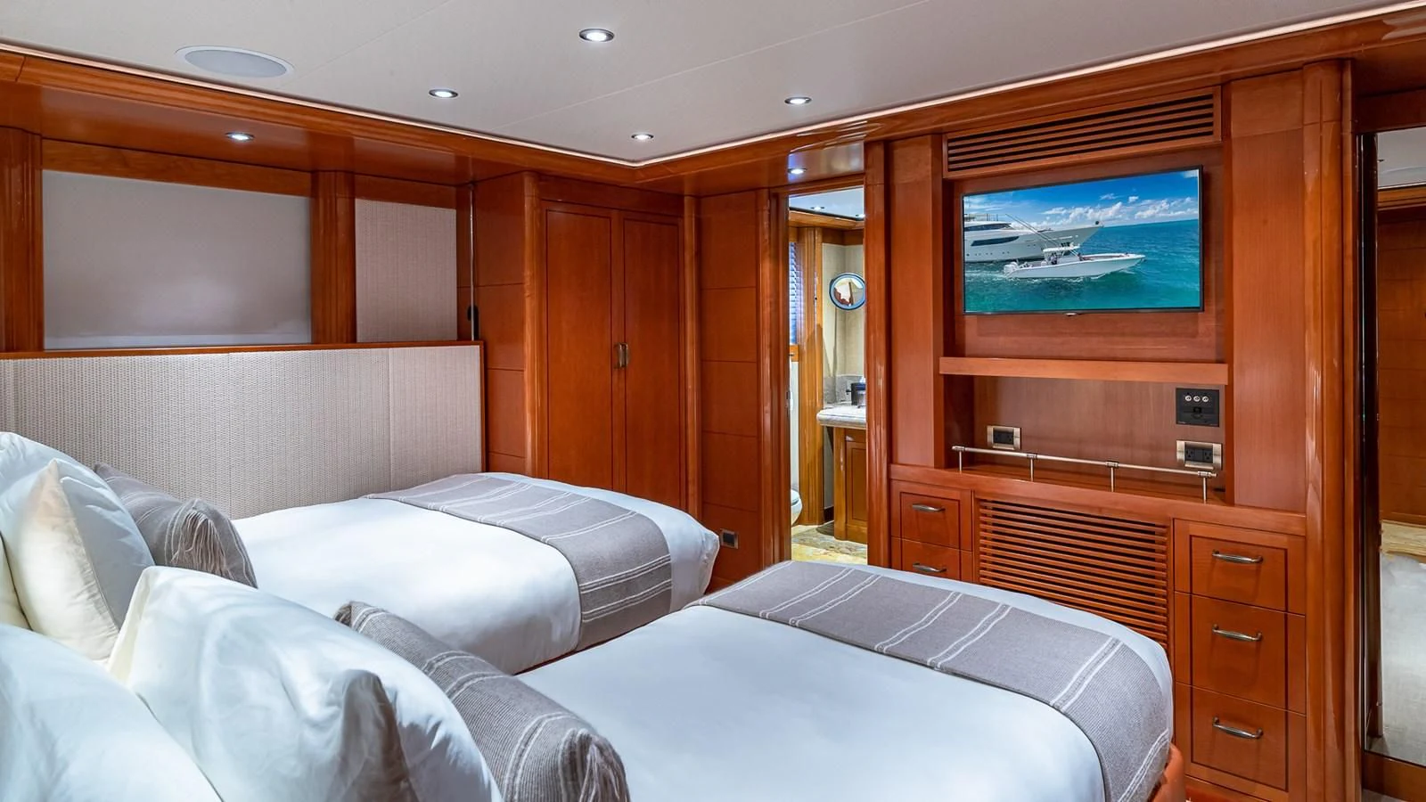 a room with a bed and a television aboard AS YOU WISH Yacht for Sale