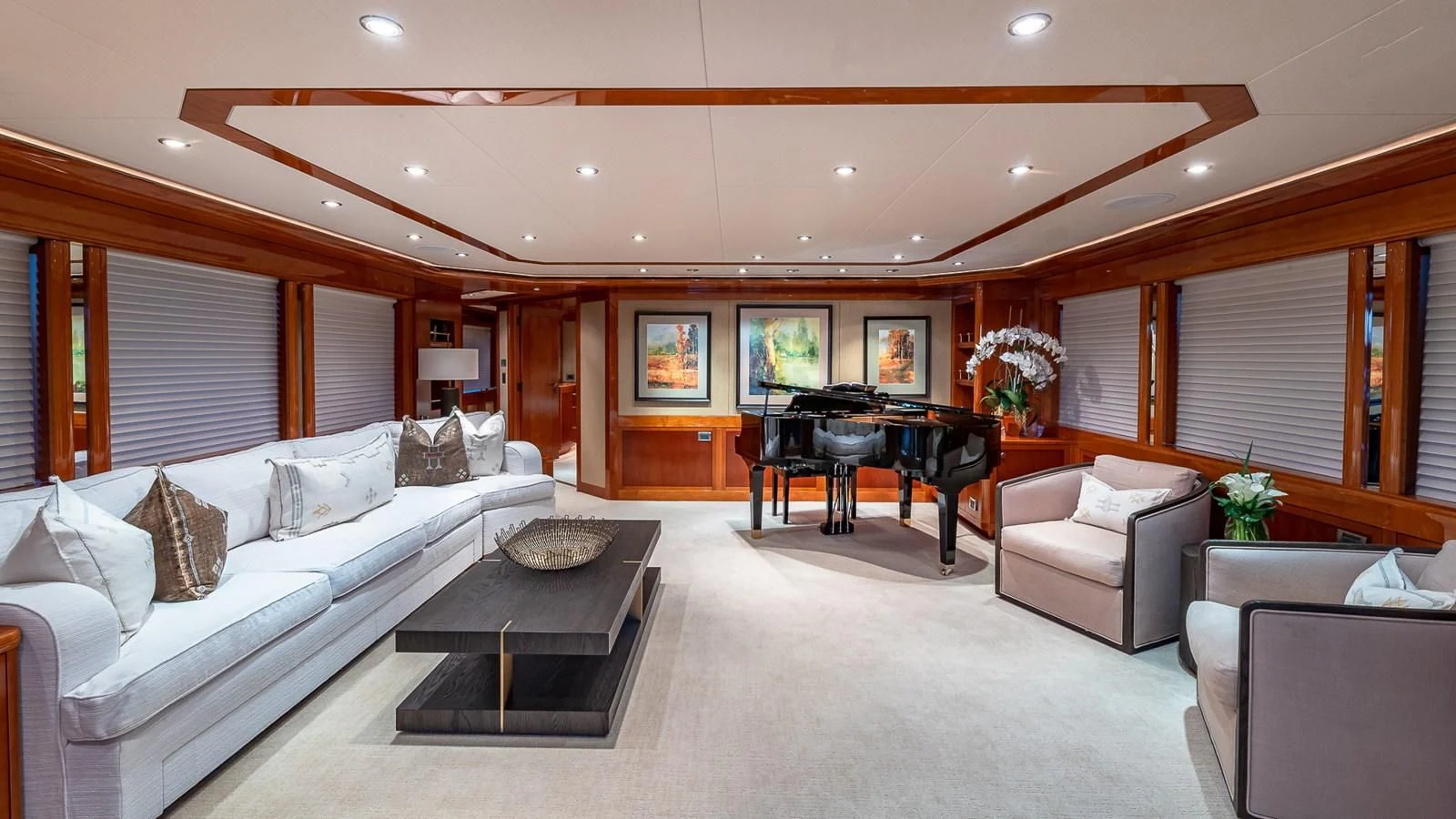 a living room with a piano and a piano aboard AS YOU WISH Yacht for Sale
