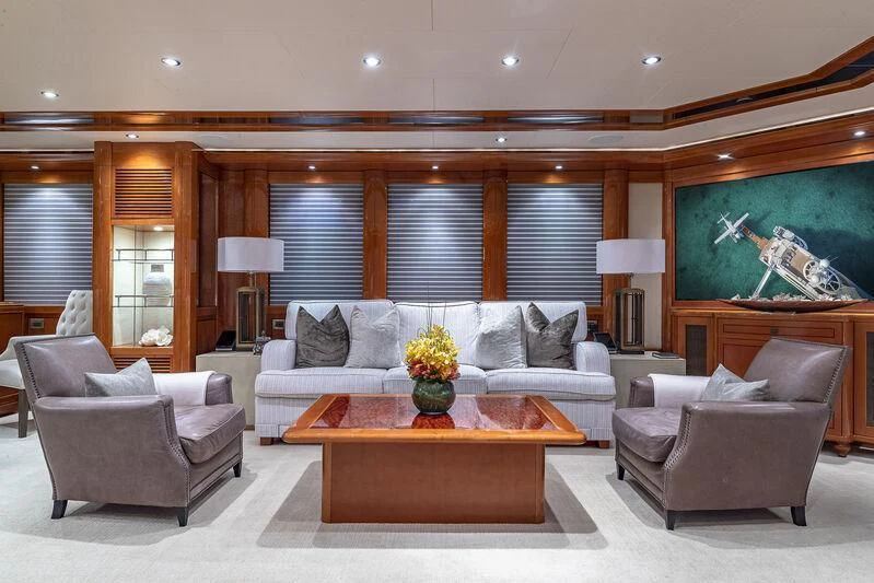 a living room with a couch and a coffee table aboard AS YOU WISH Yacht for Sale
