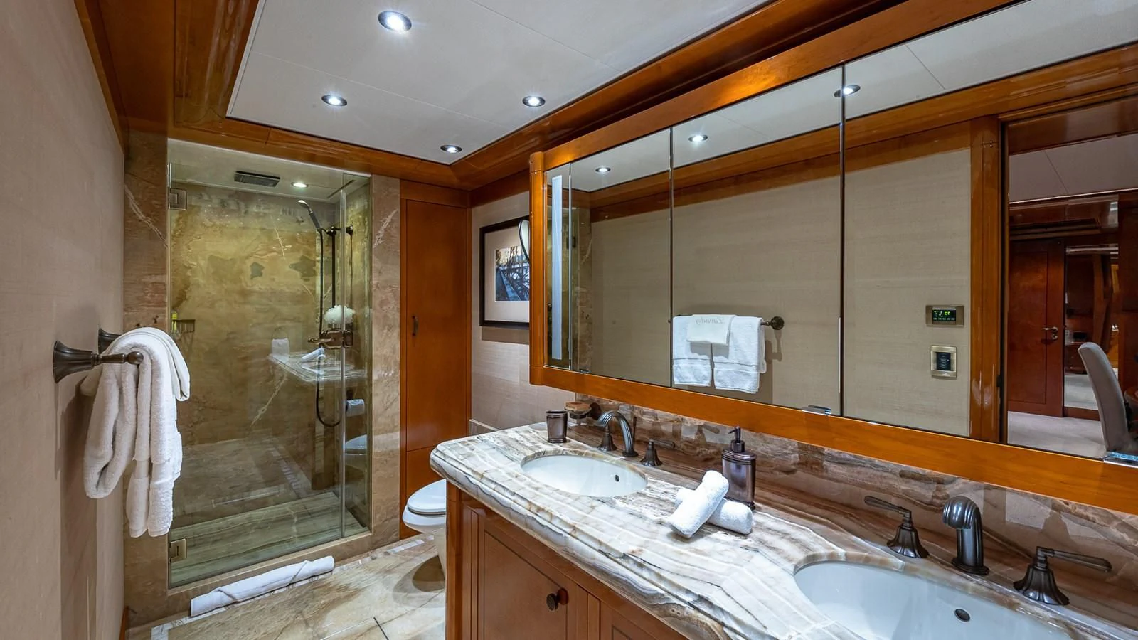 a bathroom with a large mirror aboard AS YOU WISH Yacht for Sale