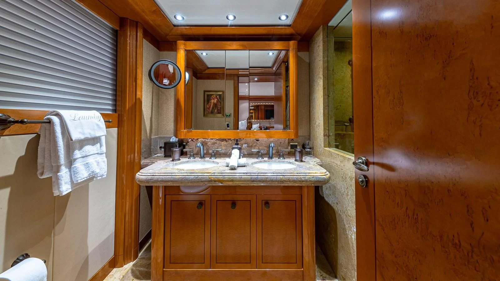 a bathroom with a sink and mirror aboard AS YOU WISH Yacht for Sale
