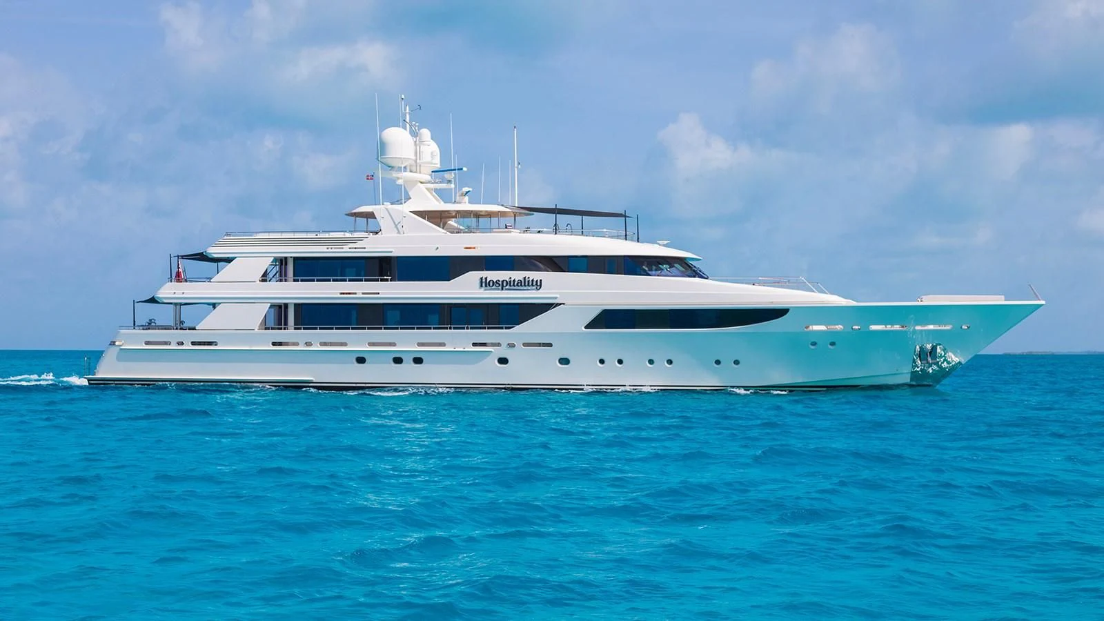 a white yacht in the water aboard AS YOU WISH Yacht for Sale