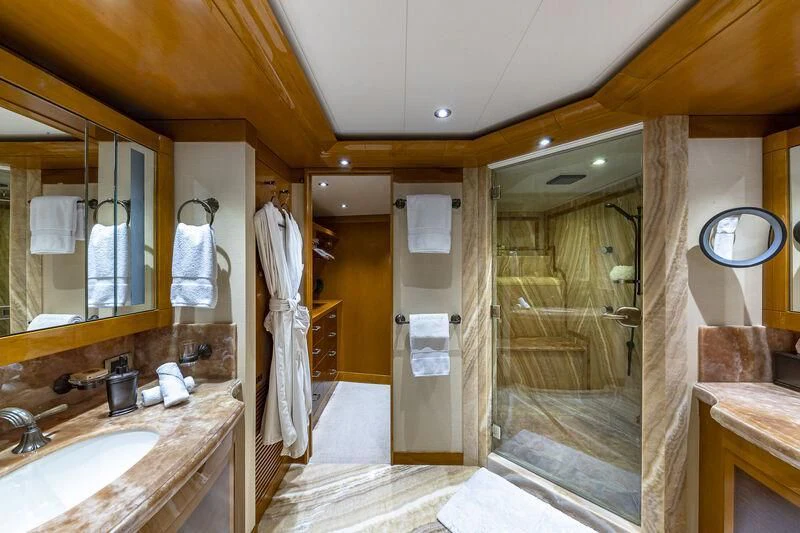 a bathroom with a shower and sink aboard AS YOU WISH Yacht for Sale