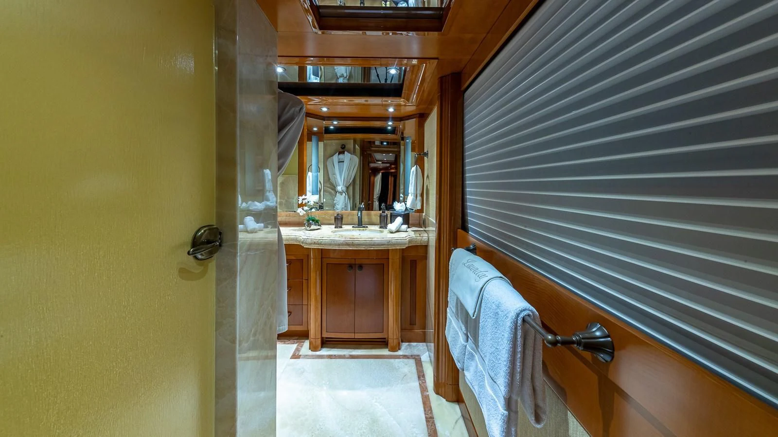 a bathroom with a sink and towels aboard AS YOU WISH Yacht for Sale