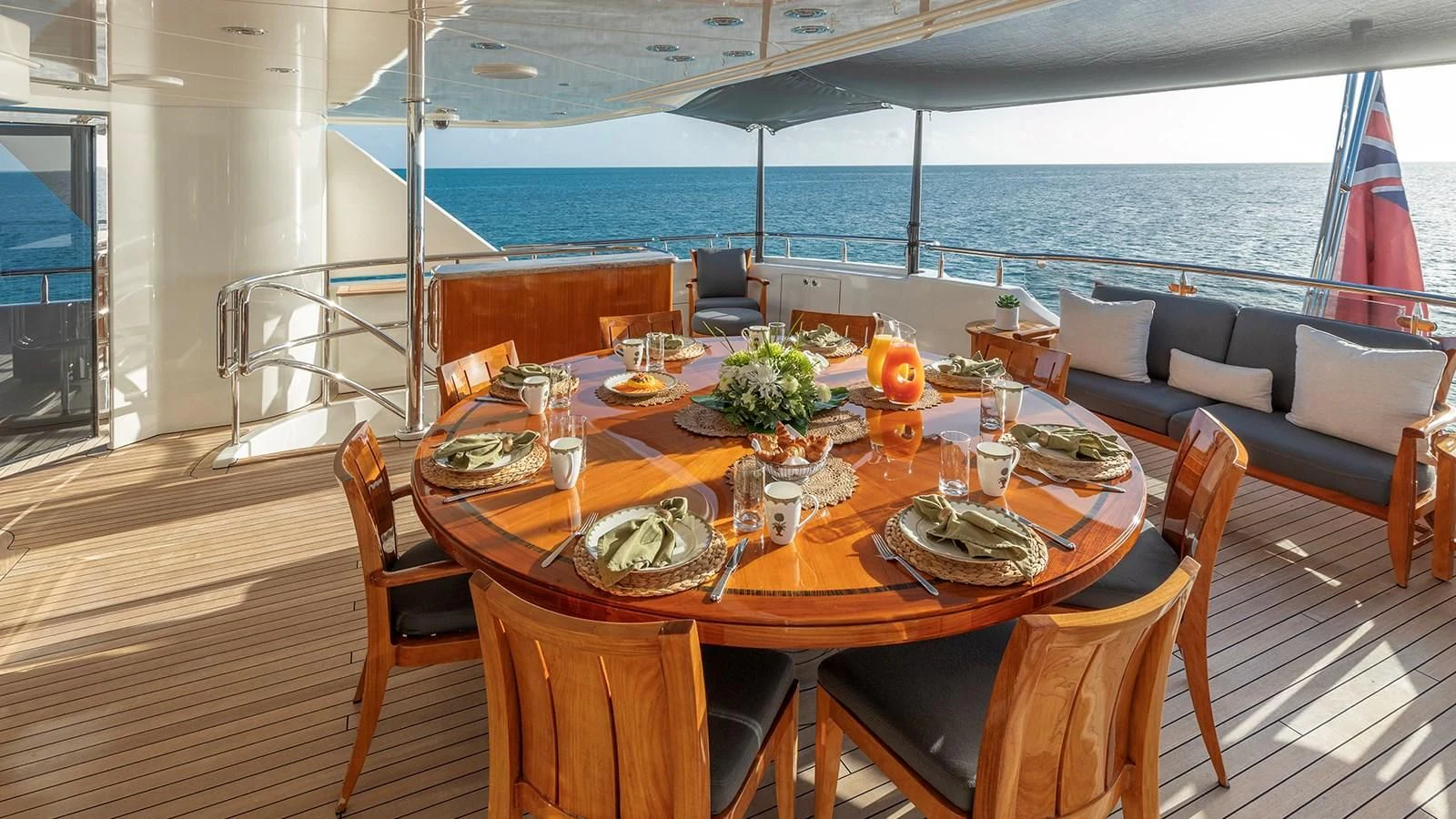 a table set for a meal on a deck aboard AS YOU WISH Yacht for Sale