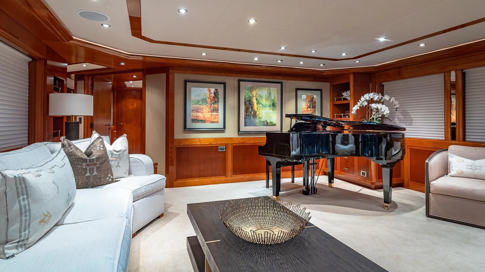 a living room with a piano aboard AS YOU WISH Yacht for Sale