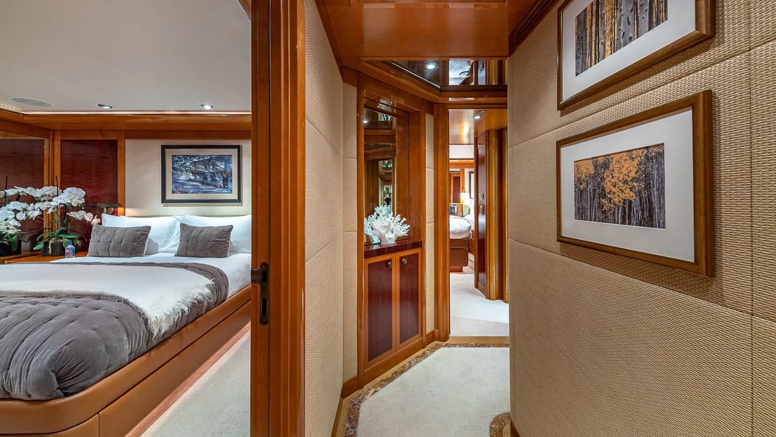 a bedroom with a bed and a door aboard AS YOU WISH Yacht for Sale