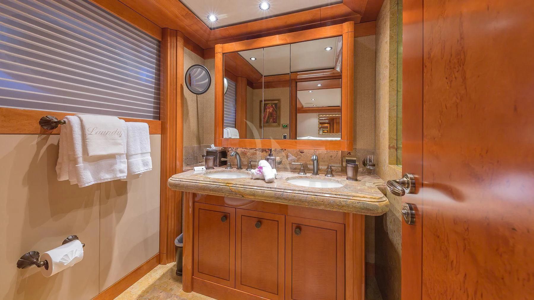 a bathroom with a sink and a mirror aboard AS YOU WISH Yacht for Sale