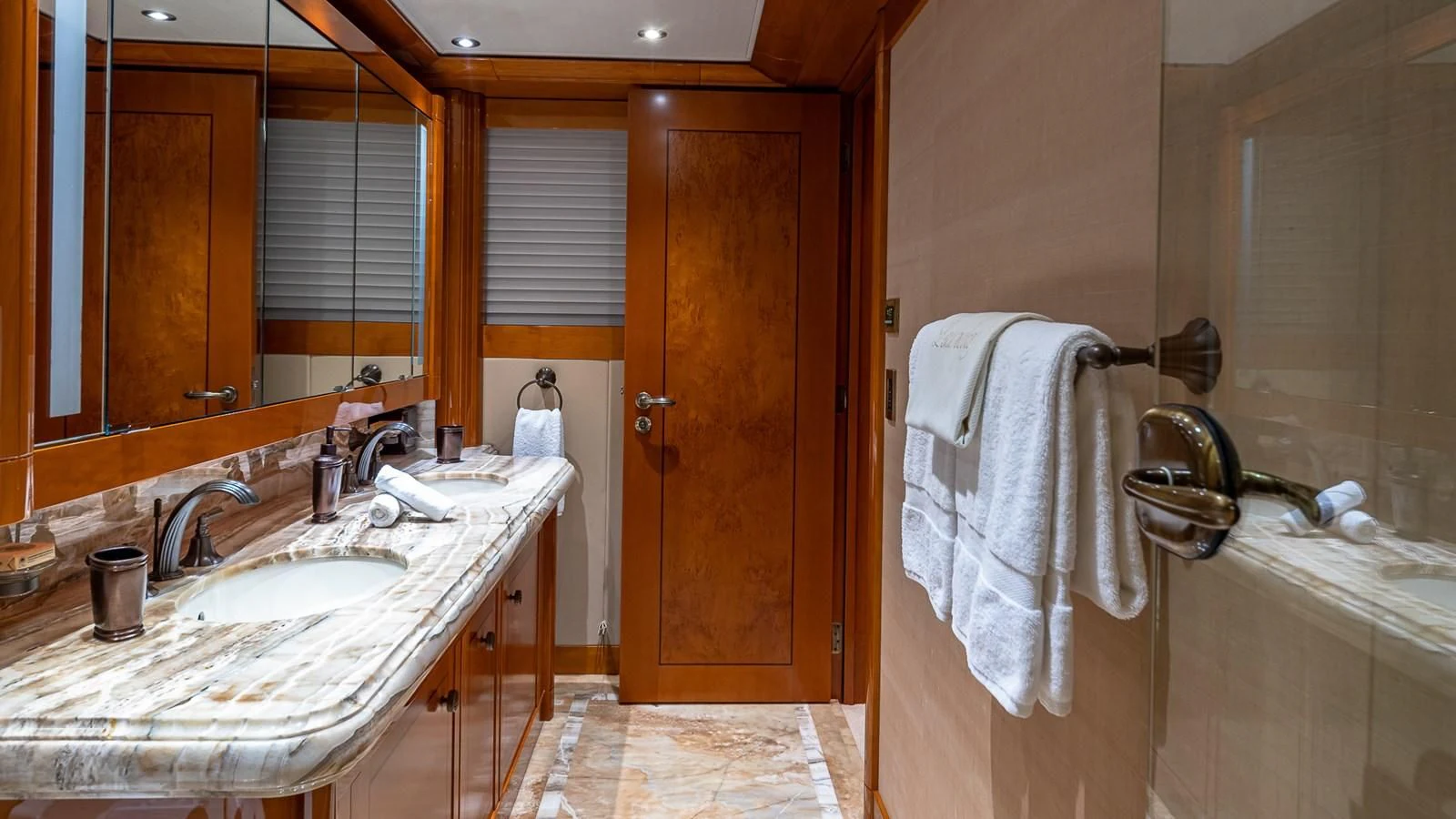 a bathroom with a sink and a mirror aboard AS YOU WISH Yacht for Sale