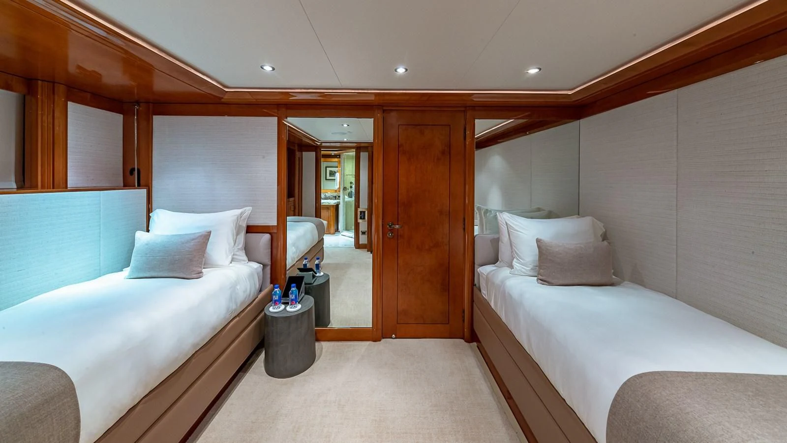 a room with a bed and a mirror aboard AS YOU WISH Yacht for Sale