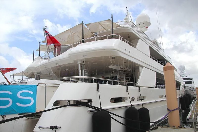 a white boat with a flag on the front aboard AS YOU WISH Yacht for Sale
