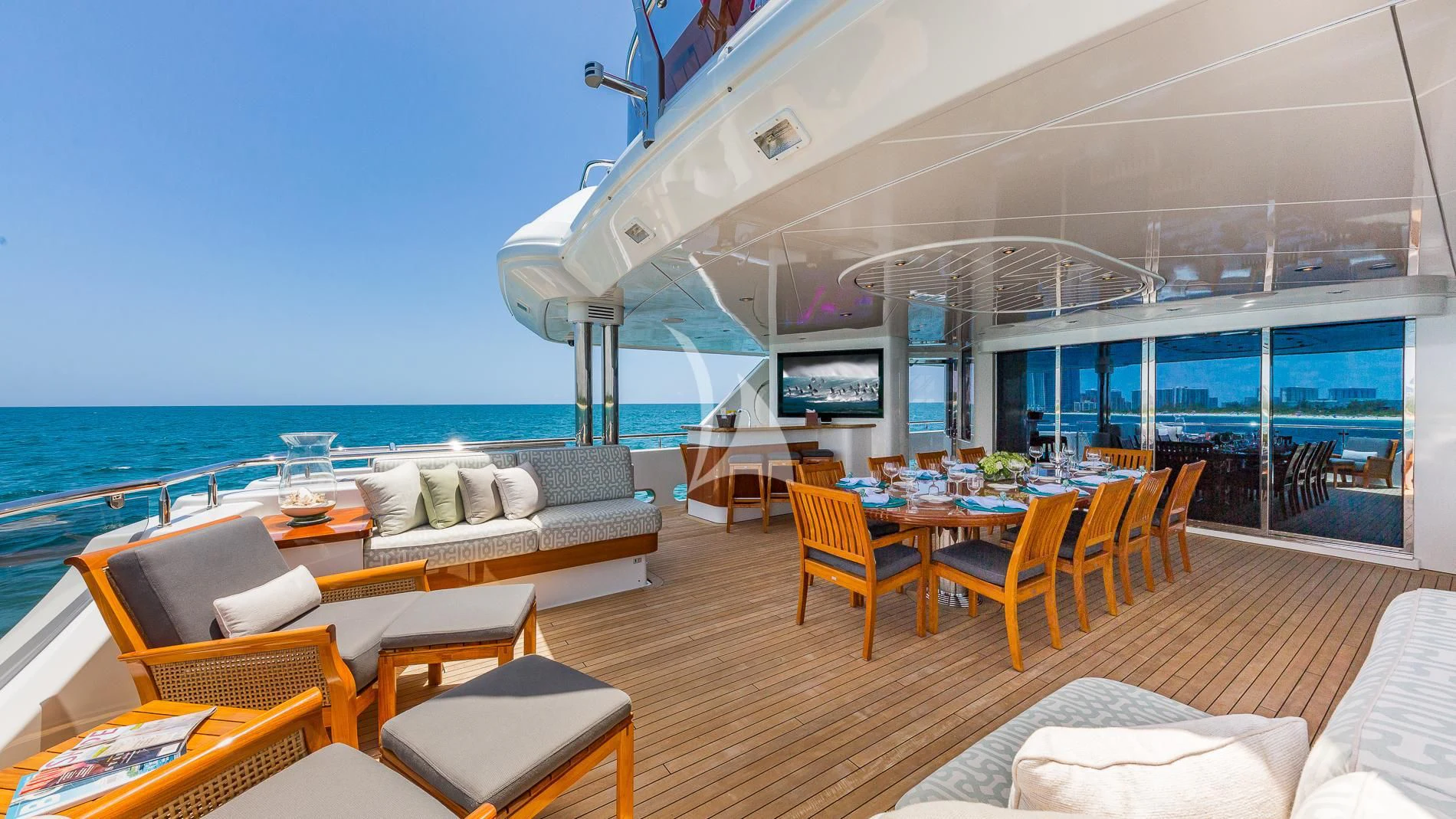 a room with a large table and chairs and a large window aboard AS YOU WISH Yacht for Sale