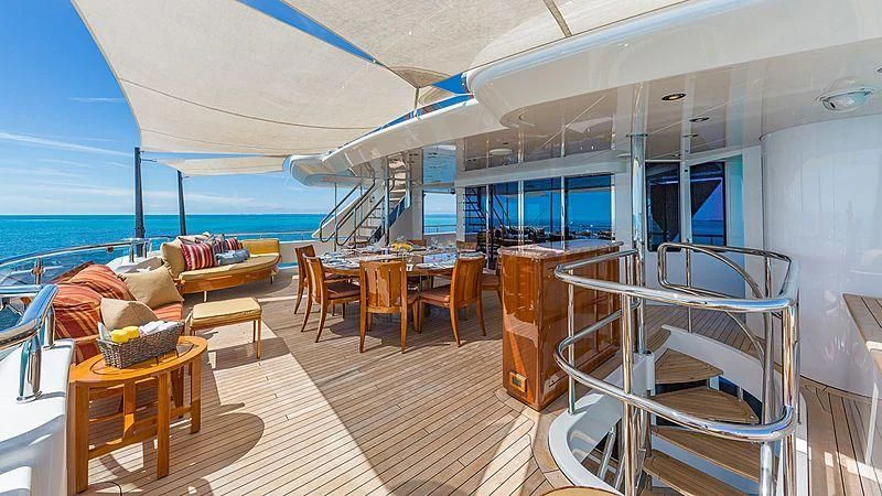 a room with a table chairs and a large window aboard AS YOU WISH Yacht for Sale