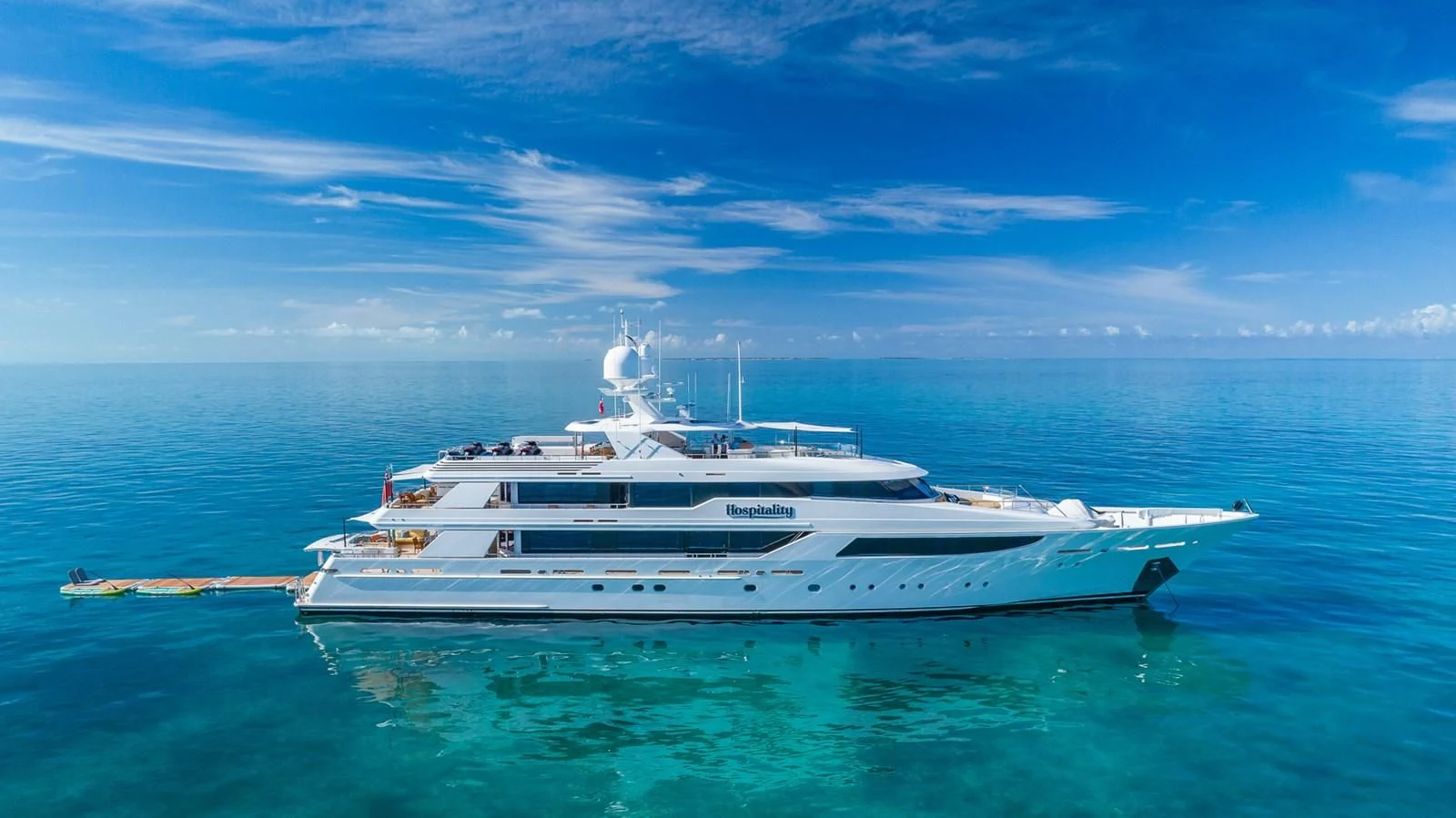 a white yacht in the water aboard AS YOU WISH Yacht for Sale