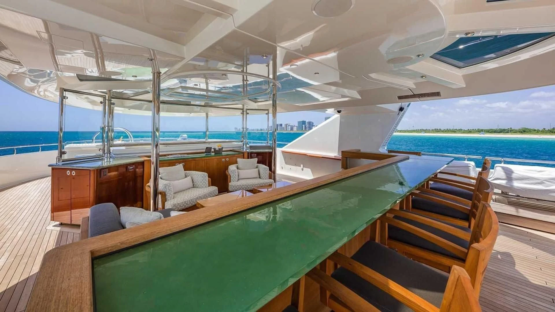 a boat with a deck and chairs aboard AS YOU WISH Yacht for Sale