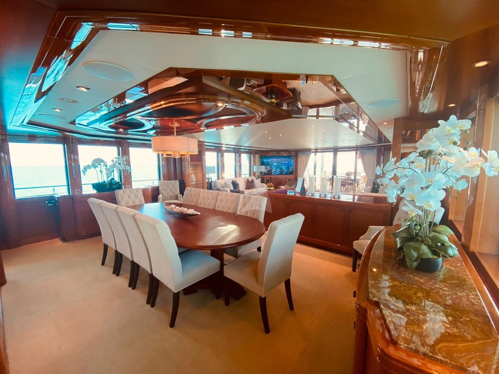 a large room with a table and chairs aboard AS YOU WISH Yacht for Sale