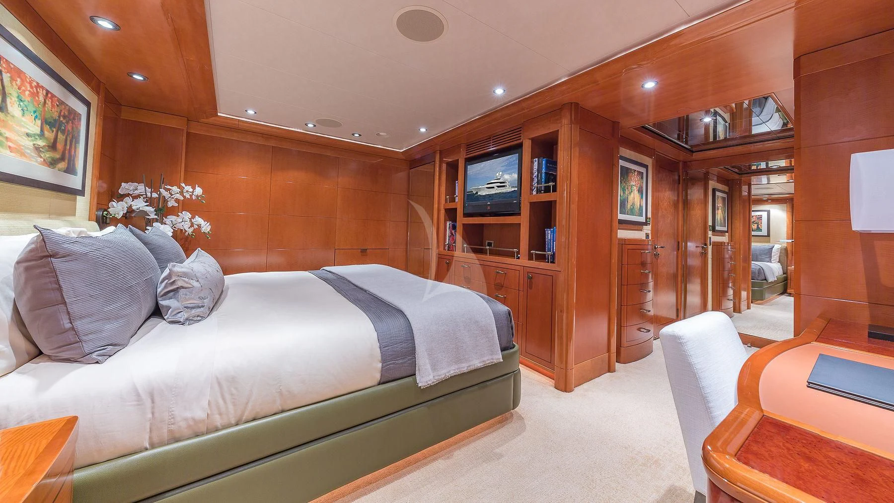 a bedroom with a bed and a desk aboard AS YOU WISH Yacht for Sale