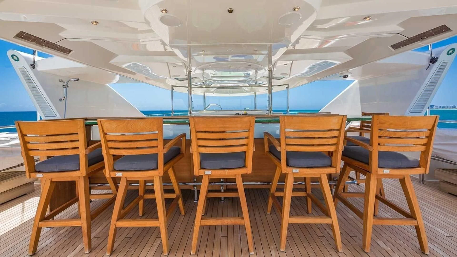 a boat with chairs on the deck aboard AS YOU WISH Yacht for Sale