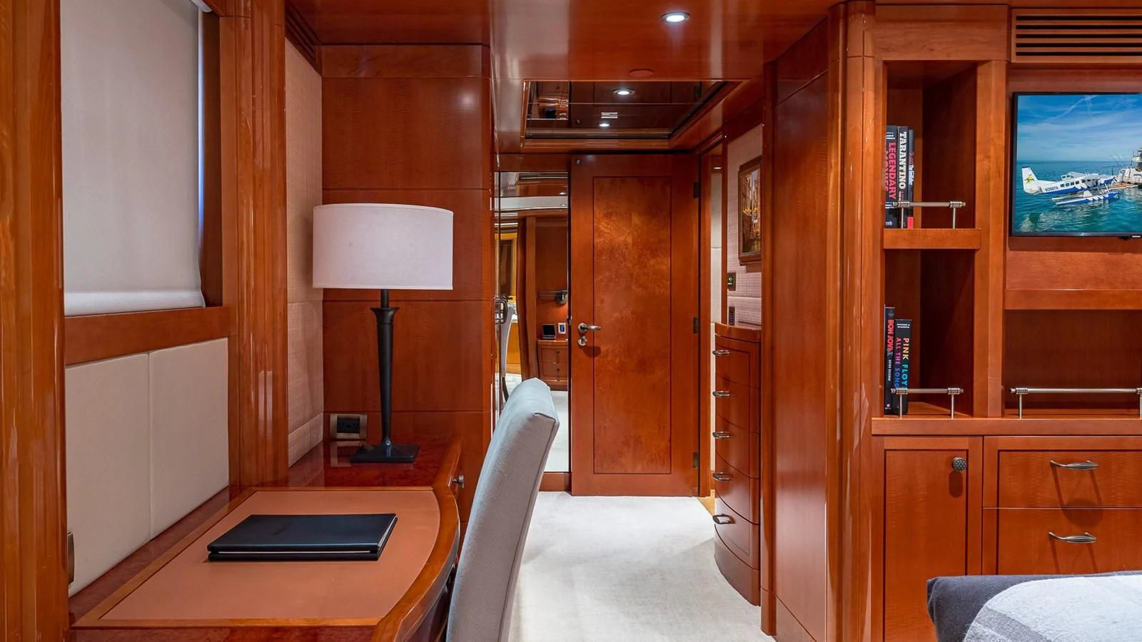 a room with a desk and a lamp aboard AS YOU WISH Yacht for Sale