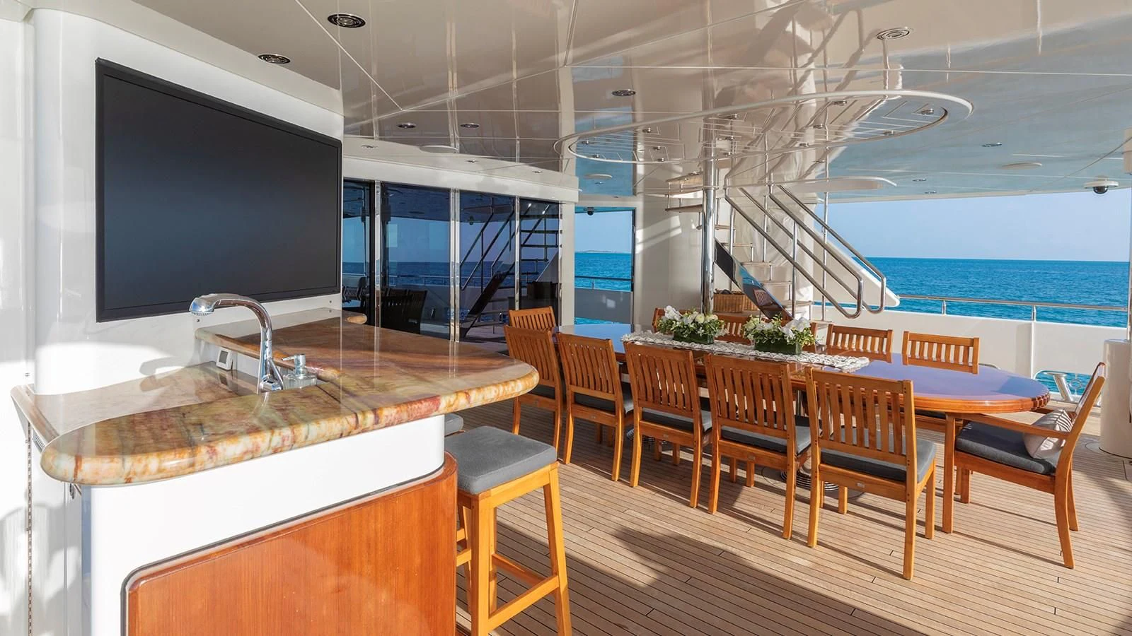 a modern looking kitchen with a large tv aboard AS YOU WISH Yacht for Sale