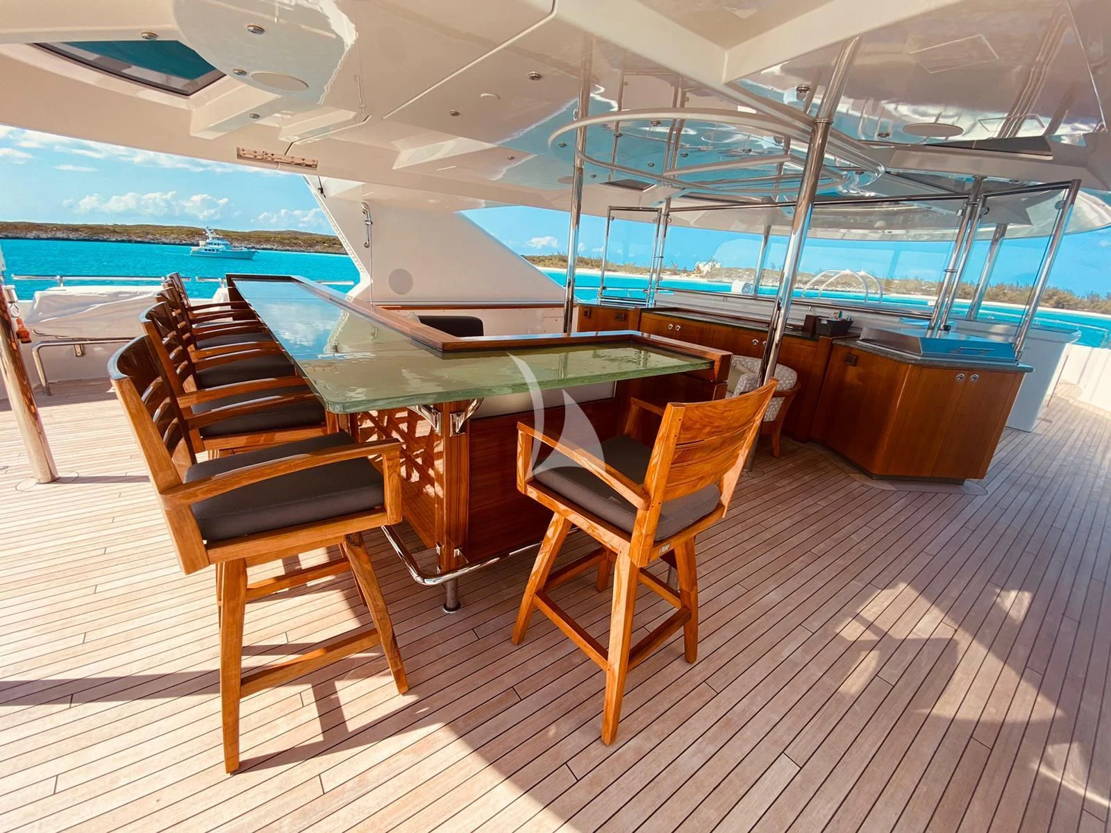 a pool table and chairs on a deck aboard AS YOU WISH Yacht for Sale