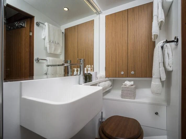a bathroom with a sink and toilet aboard ALEXA OF LONDON Yacht for Sale