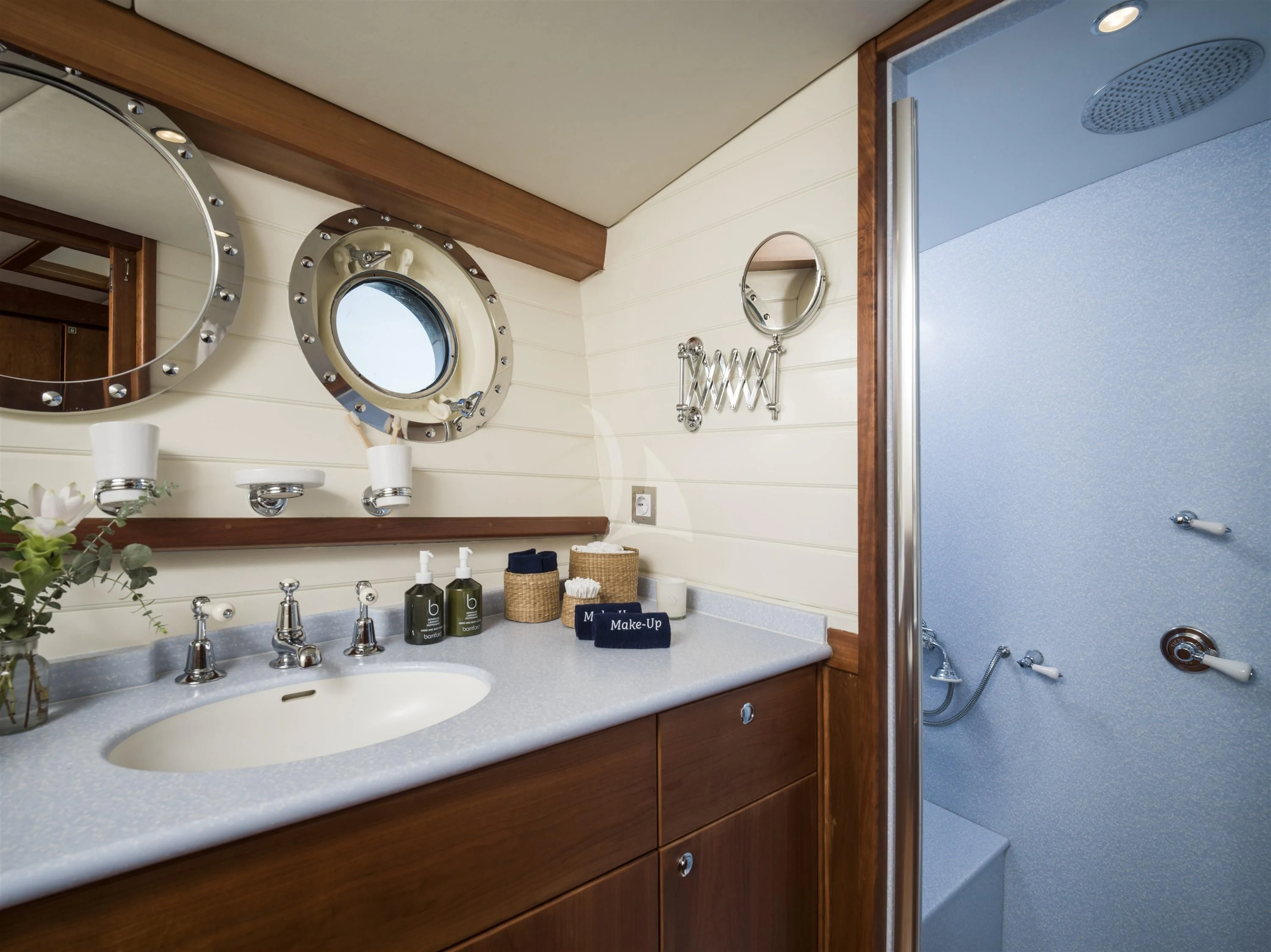 a bathroom with a sink and mirrors aboard ALEXA OF LONDON Yacht for Sale