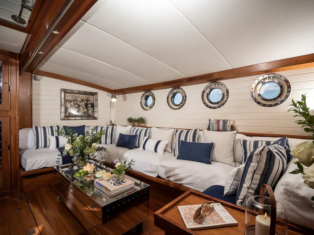 a living room with a couch and a coffee table aboard ALEXA OF LONDON Yacht for Sale