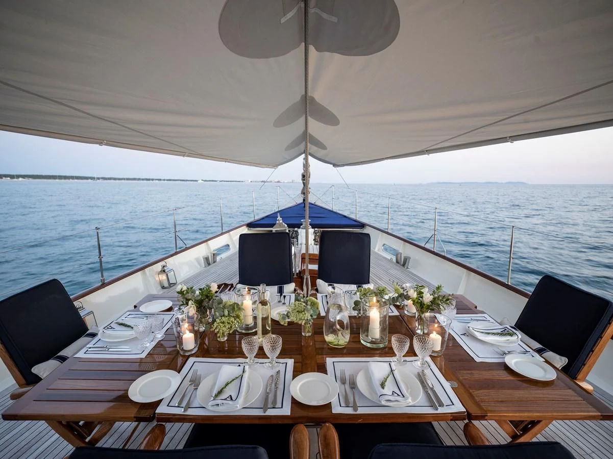 a table set for a dinner aboard ALEXA OF LONDON Yacht for Sale