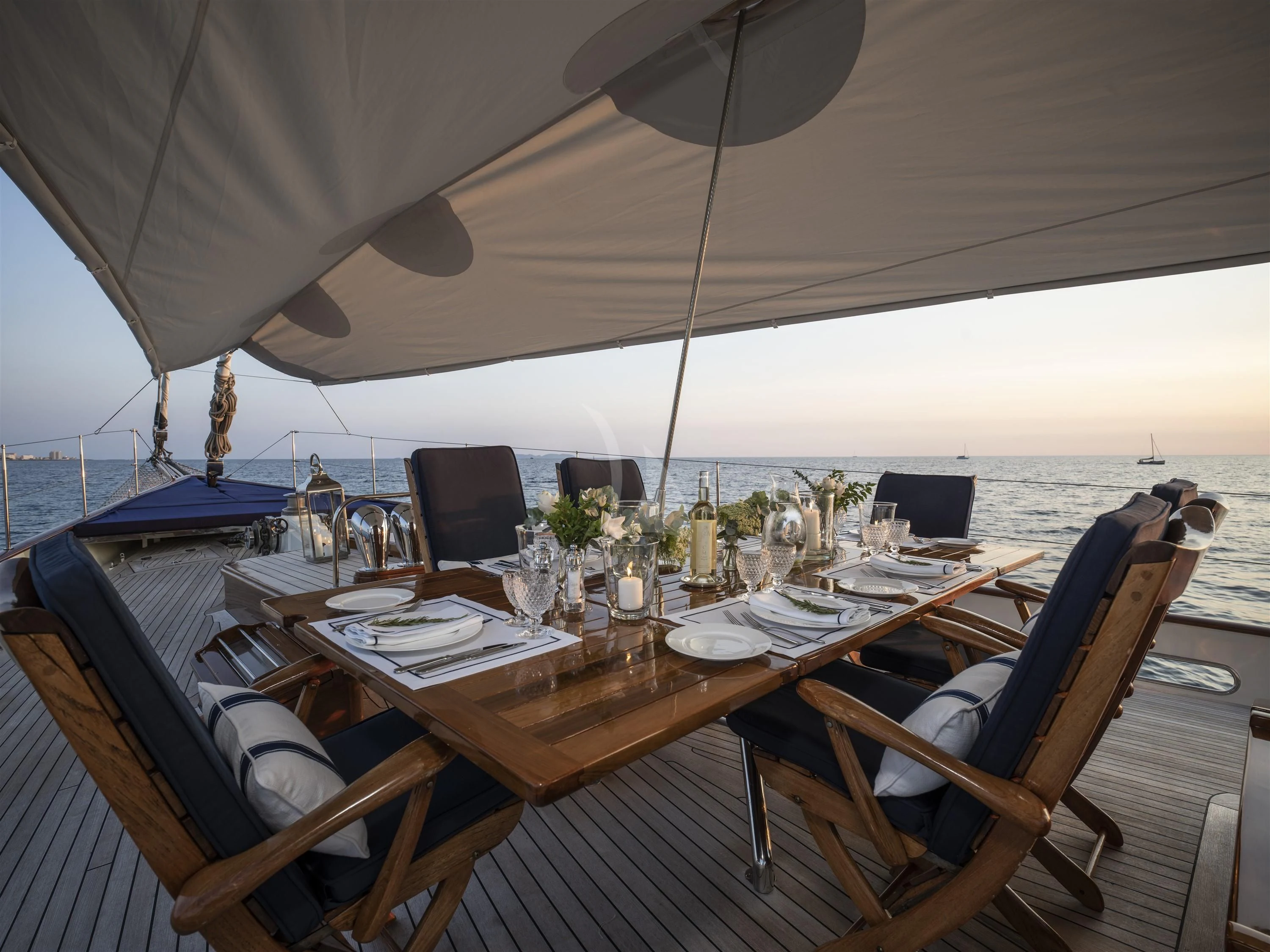 a table set for a dinner aboard ALEXA OF LONDON Yacht for Sale