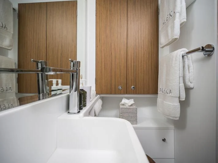 a bathroom with a sink and a mirror aboard ALEXA OF LONDON Yacht for Sale