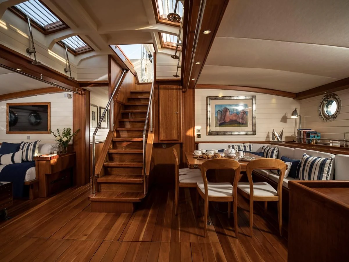 a room with a table and chairs aboard ALEXA OF LONDON Yacht for Sale