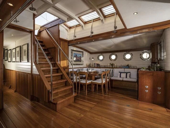 a room with wooden floors and a staircase aboard ALEXA OF LONDON Yacht for Sale