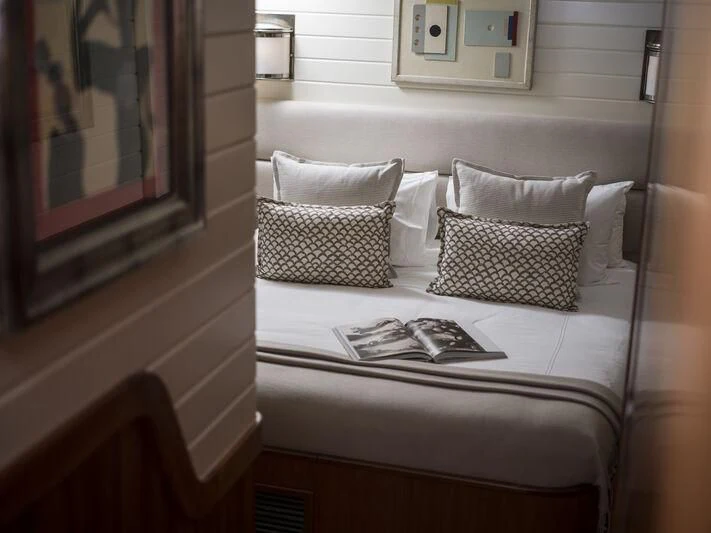 a white couch with pillows aboard ALEXA OF LONDON Yacht for Sale