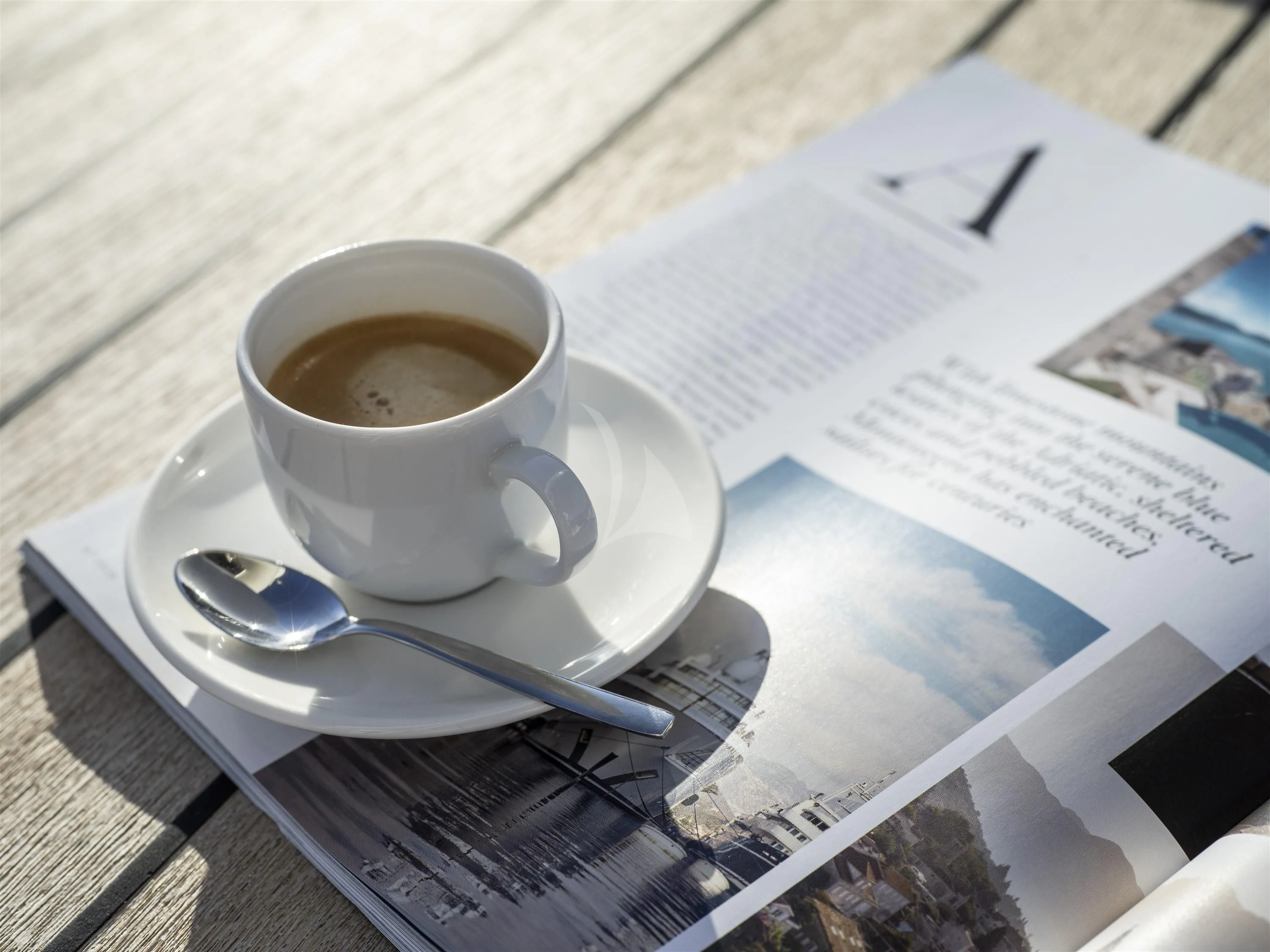 a cup of coffee on a table aboard ALEXA OF LONDON Yacht for Sale