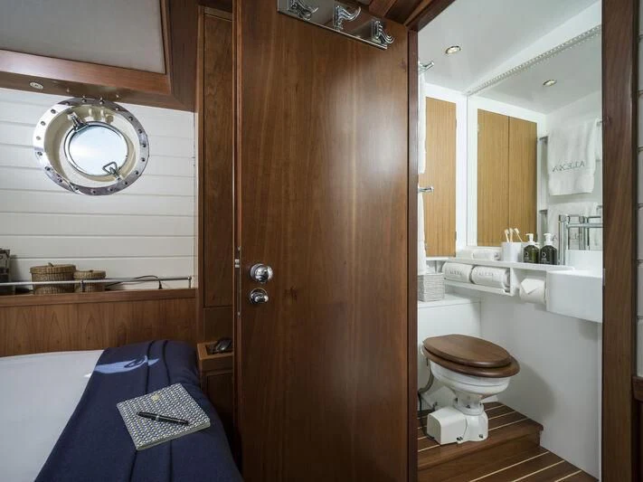 a bathroom with a blue towel aboard ALEXA OF LONDON Yacht for Sale