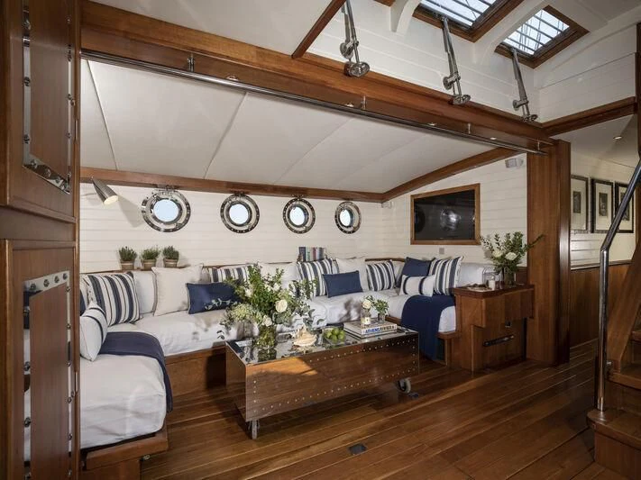 a living room with a couch and a coffee table aboard ALEXA OF LONDON Yacht for Sale