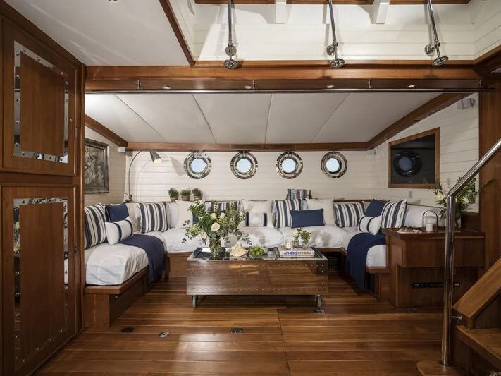 a room with a couch and a table aboard ALEXA OF LONDON Yacht for Sale