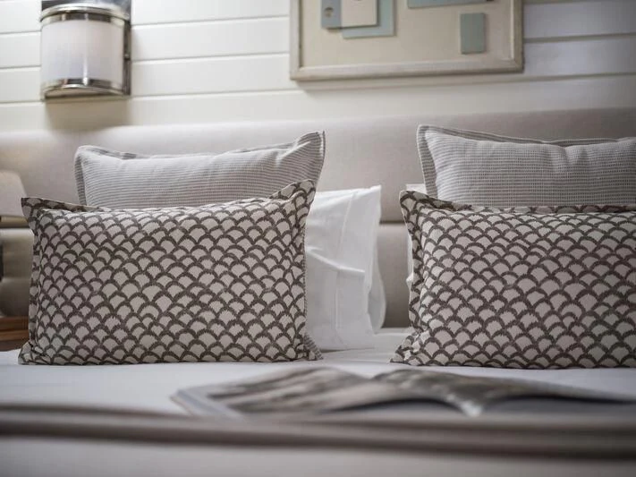 a couple of pillows on a couch aboard ALEXA OF LONDON Yacht for Sale