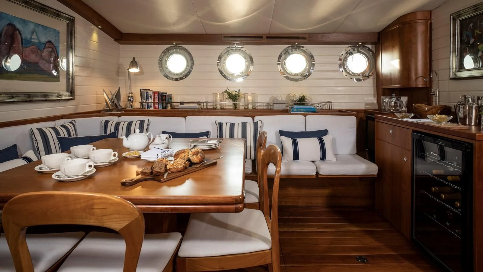 a kitchen with a dining table aboard ALEXA OF LONDON Yacht for Sale