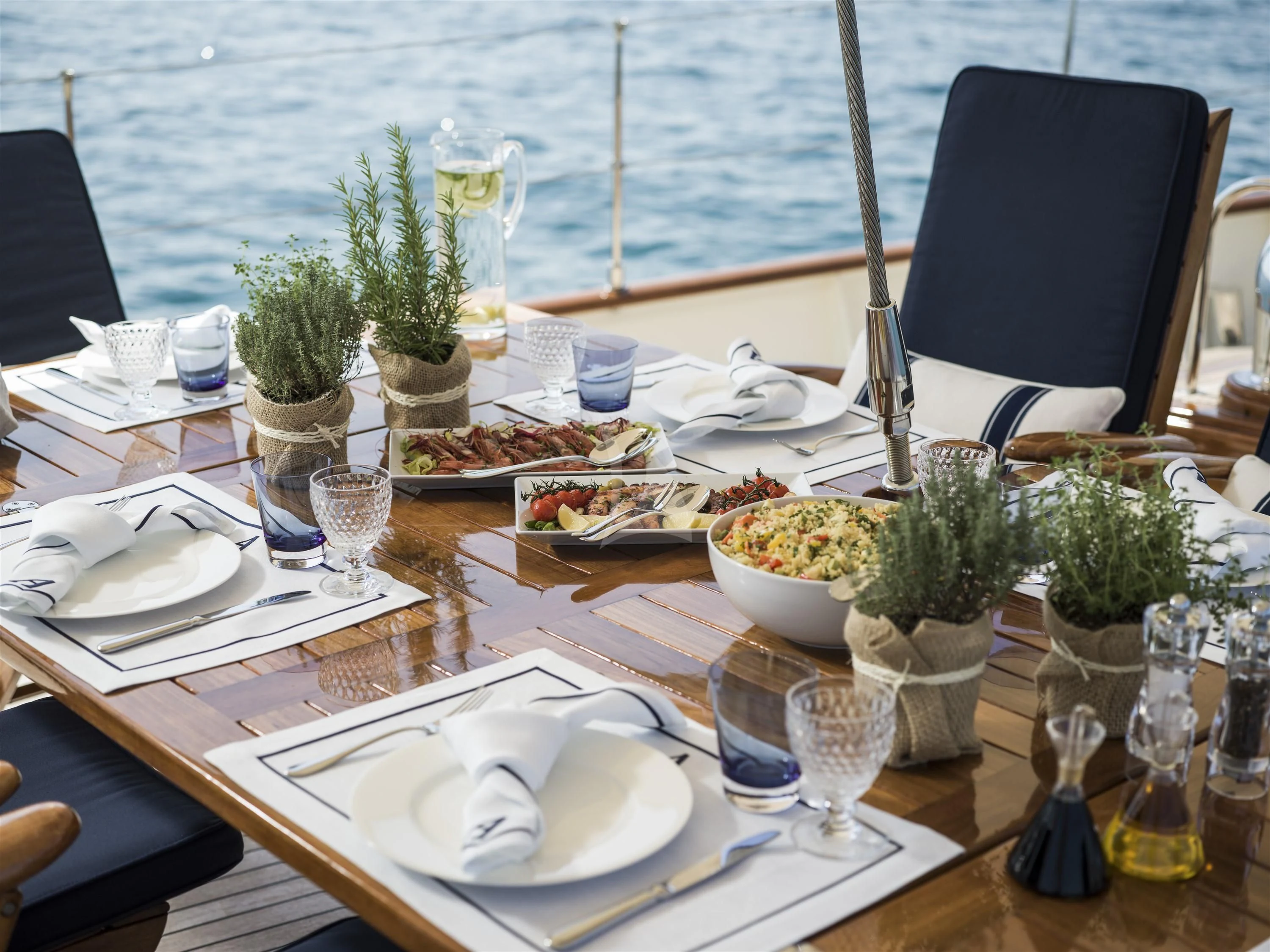a table set with food and drinks aboard ALEXA OF LONDON Yacht for Sale