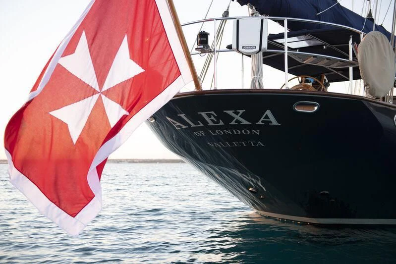 a boat with a red and white flag on it aboard ALEXA OF LONDON Yacht for Sale