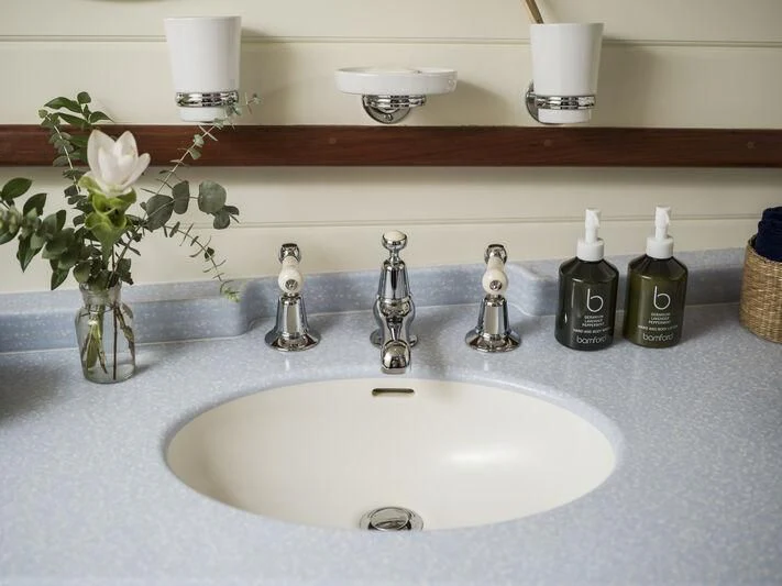 a sink with flowers on it aboard ALEXA OF LONDON Yacht for Sale